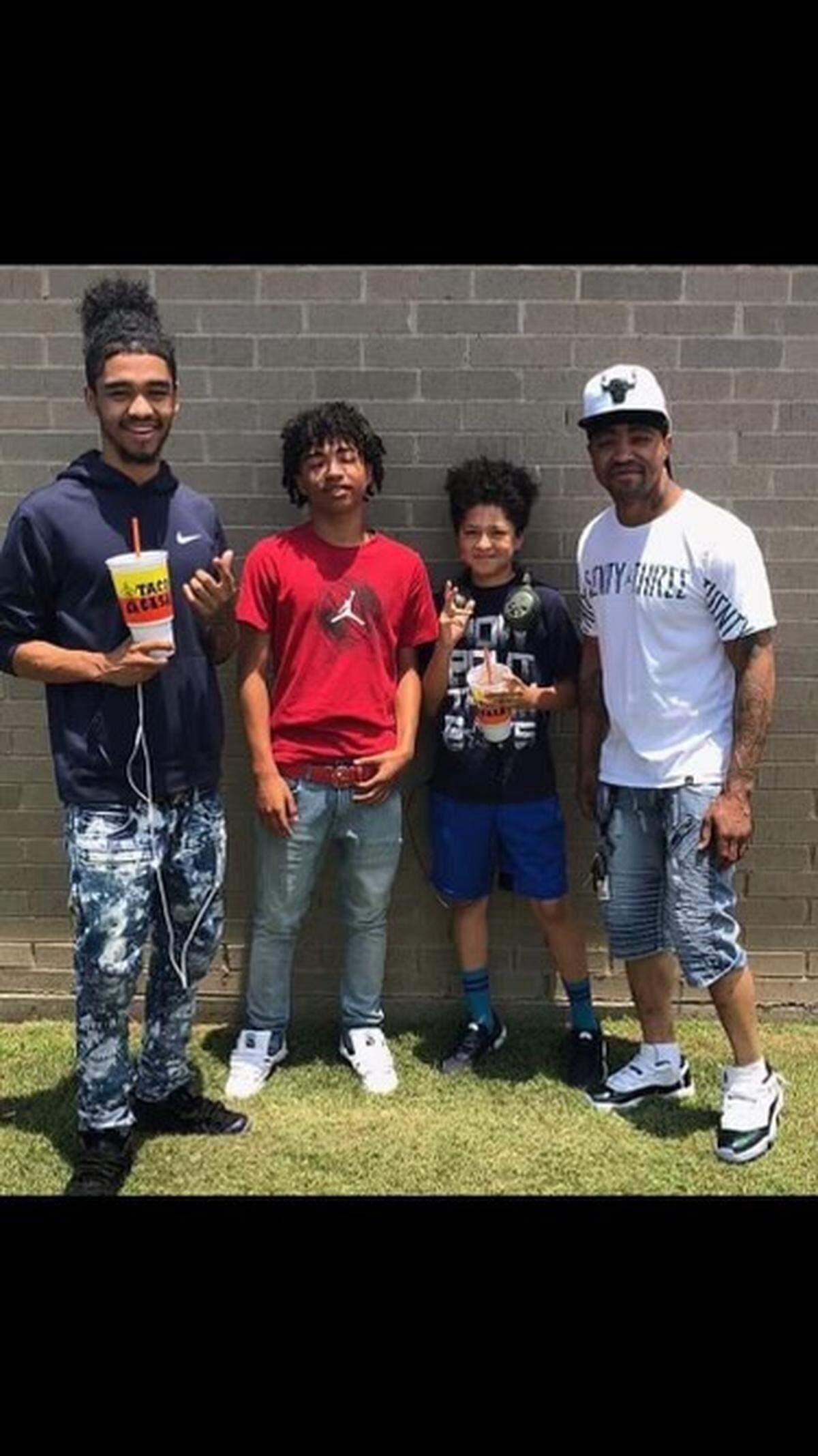 Marcell Nelson (far right) poses with some of his children. Nelson, 42, was one of the people killed in a shooting Friday in Kansas City that involved a police officer.