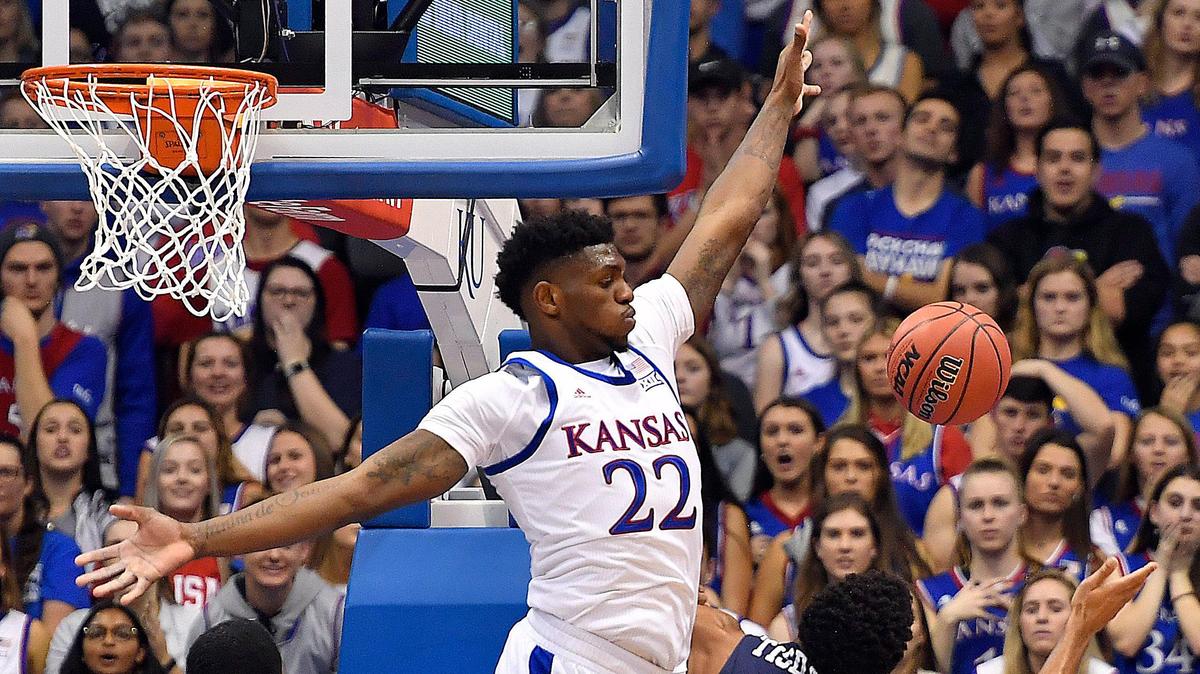 KU’s Silvio De Sousa (22) swats a shot by East Tennessee State’s Isaiah Tisdale during the first half of a recent game at Allen Fieldhouse.