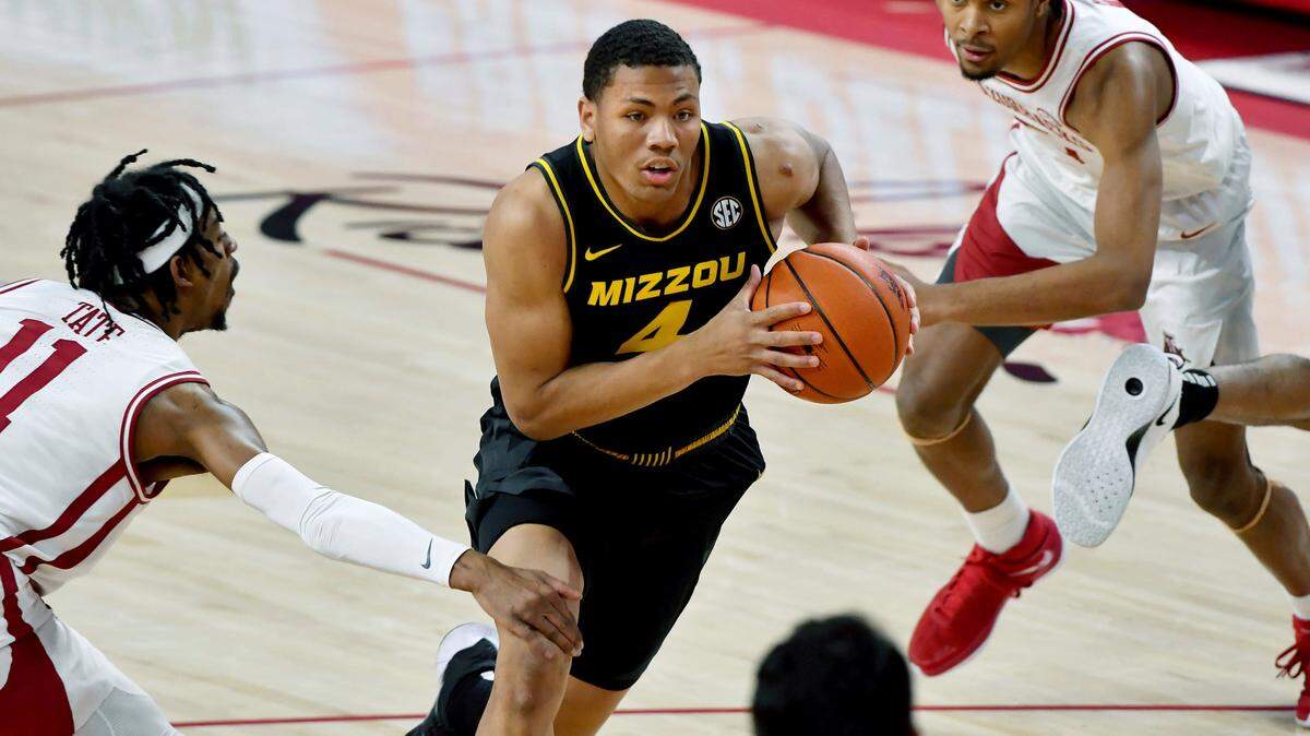 Missouri guard Javon Pickett (4) drives to the hoop against Arkansas during the second half of an NCAA college basketball game in Fayetteville, Ark. Saturday, Jan. 2, 2021. (AP Photo/Michael Woods)