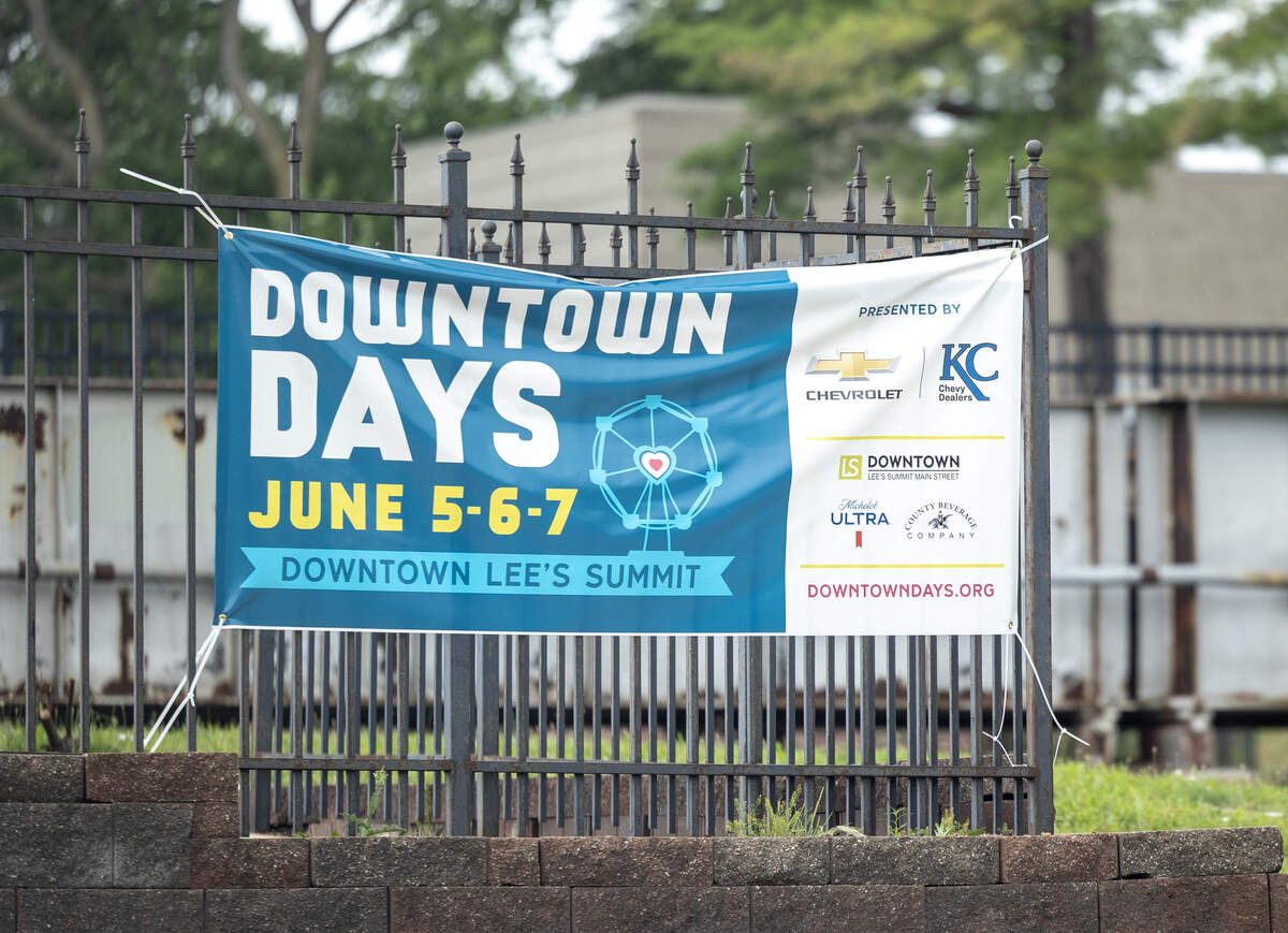 A banner for Downtown Days hangs on a fence in Lee’s Summit on Monday, June 8.