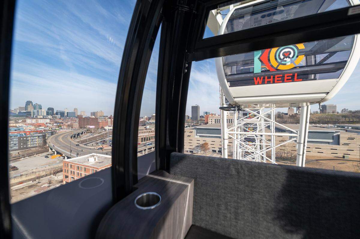 A skyline view of Kansas City is seen from the VIP gondola looking northeast on the KC Wheel at Pennway Point district.