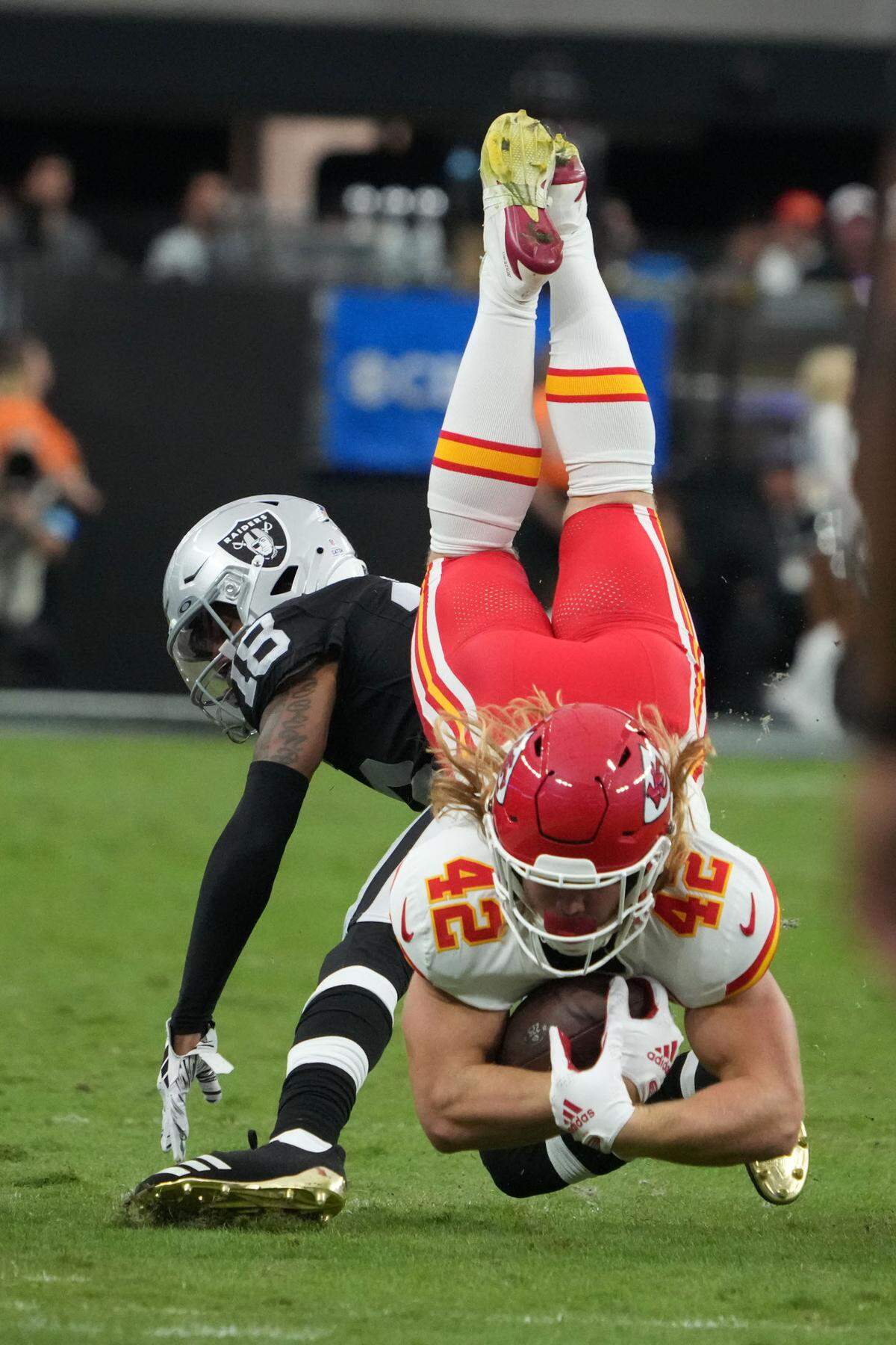 Kansas City Chiefs running back Carson Steele is tackled by Las Vegas Raiders cornerback Jack Jones during an Oct. 27, 2024 NFL game at Allegiant Stadium in Paradise, Nevada.