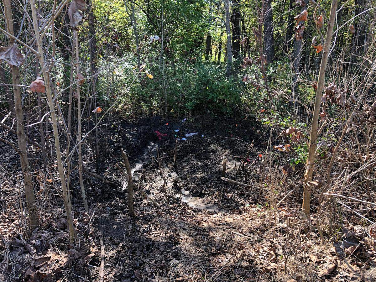 A dirt bike rider found Ryan Linneman’s damaged car in the gully at the bottom of a 50-foot steep incline between Raytown Road and View High Drive. He had been missing for a week.