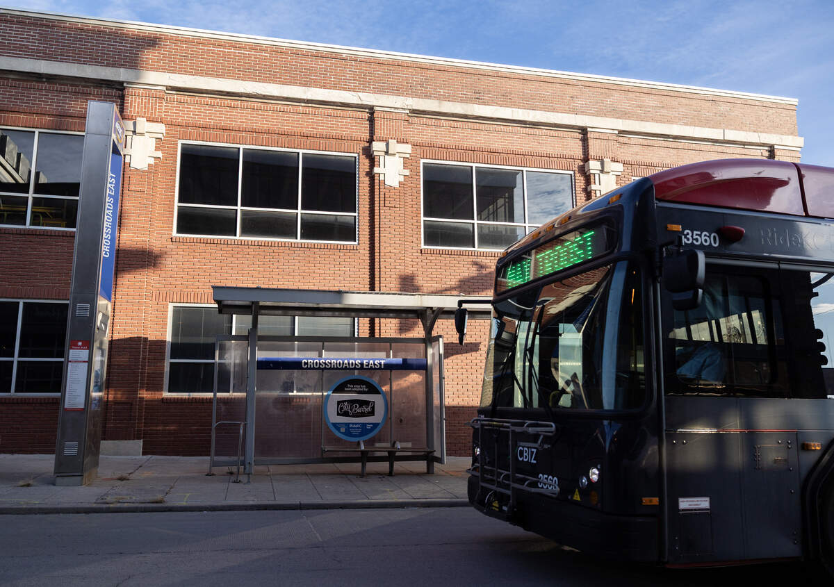 A RideKC bus zips past a soon-to-be redeveloped bus stop at the intersection of 18th and Holmes streets outside the Holtman Building in Kansas City.
