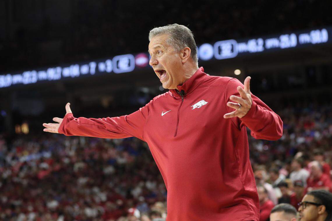 Arkansas Razorbacks coach John Calipari shouts instructions to his players during Friday evening’s exhibition game against the Kansas Jayhawks at Bud Walton Arena in Fayetteville, Ark.