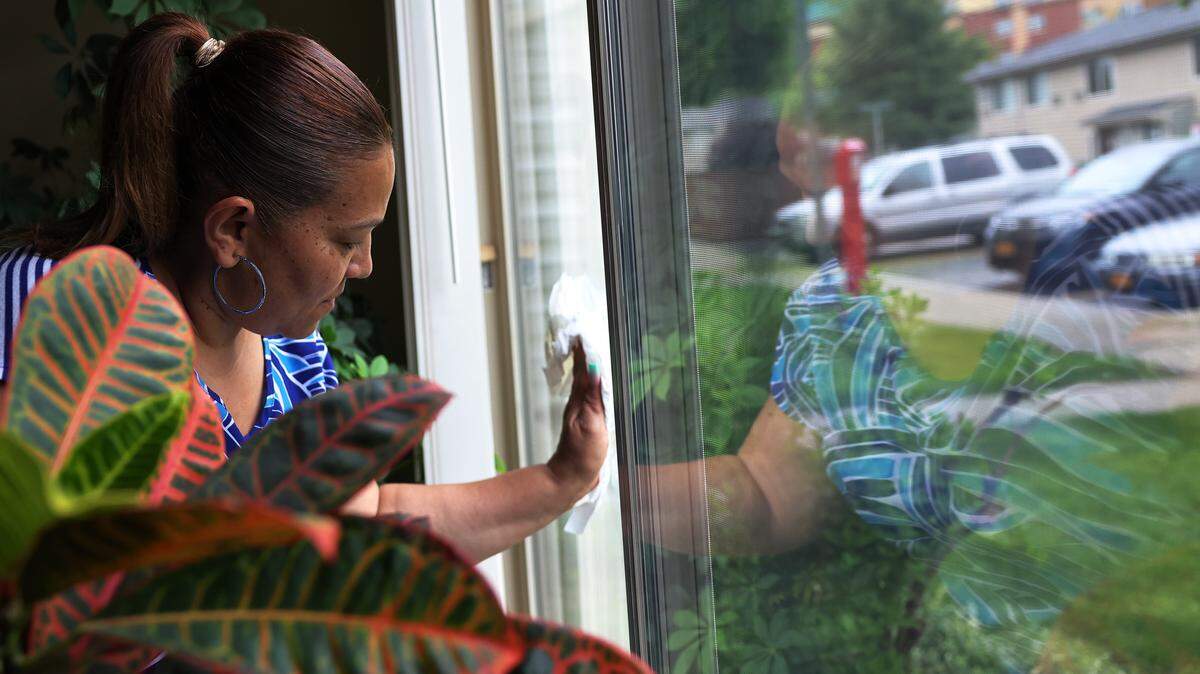 A woman cleaning her windows.