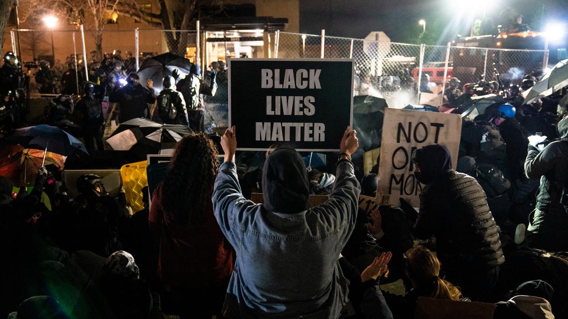 Demonstrators take part in a protest over the fatal shooting Sunday of Daunte Wright during a traffic stop, outside the Brooklyn Center Police Department, Wednesday, April 14, 2021, in Brooklyn Center, Minn. (AP Photo/John Minchillo)