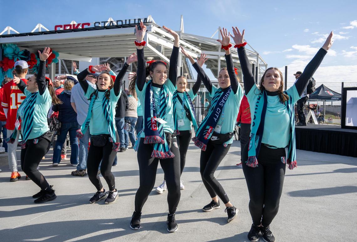 Teal-clad women dance at the Kansas City Current opening festivities for the Current’s new home at CPKC Stadium on Saturday, March 16, 2024, in Kansas City.