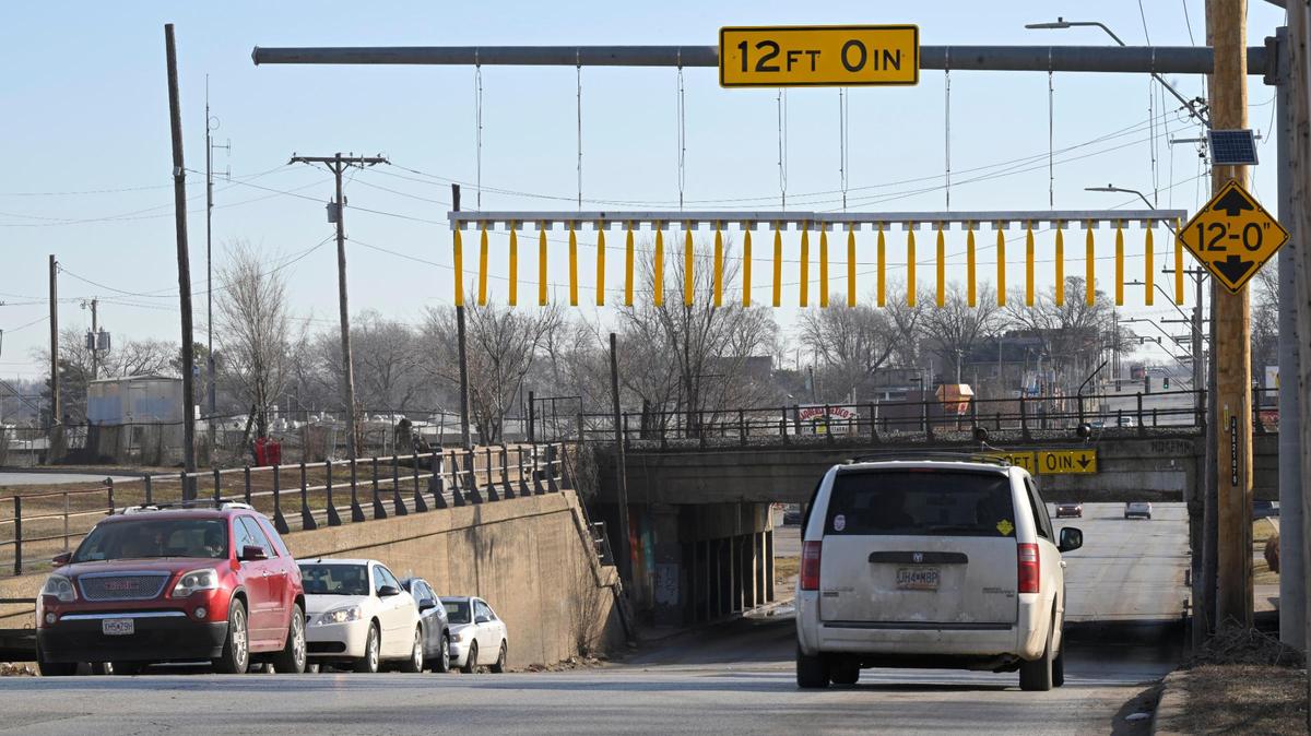 The Independence Avenue railroad bridge between Wilson Avenue and White Avenue is known for damaging trucks as they attempt to pass under the 12-foot high bridge. A bridge curtain, seen here on Friday, Feb. 2, 2024, was just installed to warn truck drivers of the low height before they reach the bridge.