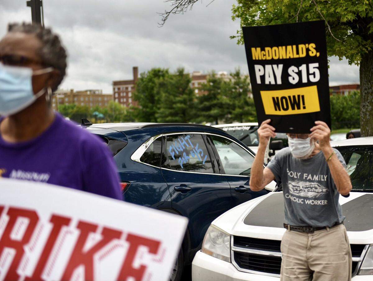Roughly 100 people gathered to demand union rights and a $15 minimum wage for fast food workers in 2021 in Kansas City. A statewide minimum wage is on the ballot in November.