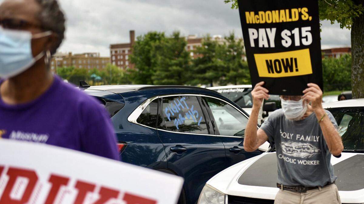A 2021 protest outside a McDonald’s in Kansas City calls for the restaurant to raise its minimum wage. A recent study shows how many hours it would take to afford rent on each state’s minimum wage.