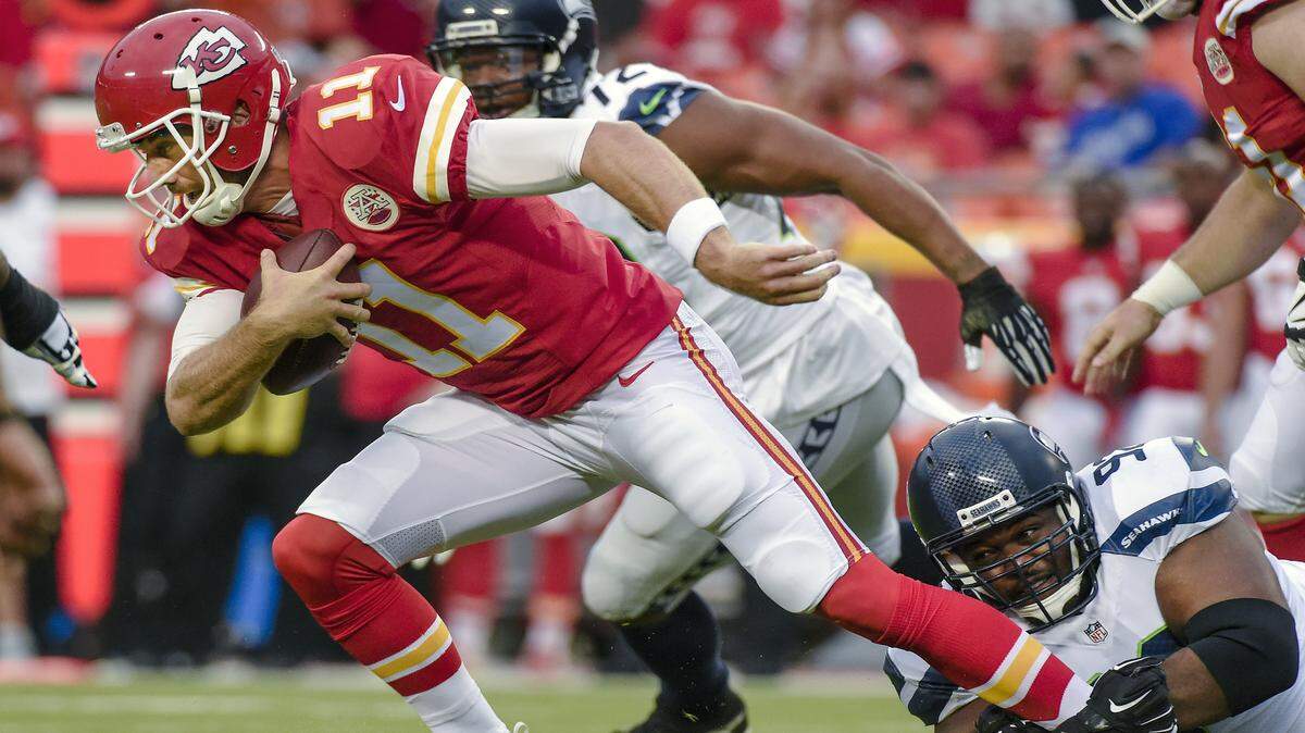 Chiefs quarterback Alex Smith is sacked by Seahawks defensive tackle Brandon Mebane during the first quarter of Friday's football game at Arrowhead Stadium.