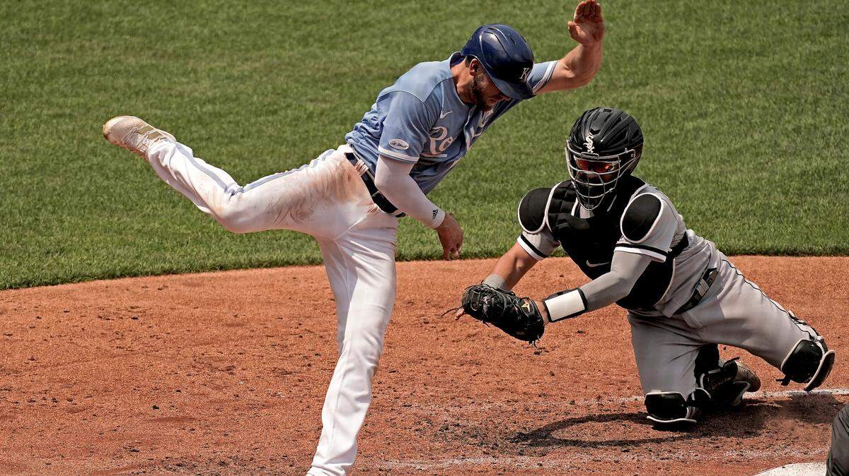 Hunter Dozier was tagged out at home by Chicago White Sox catcher Reese McGuire trying to score on a single by Kyle Isbel during the fourth inning in the Royals’ 3-0 loss Tuesday at Kauffman Stadium.