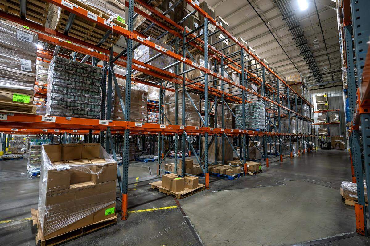 Partially empty shelves line the Harvesters food bank warehouse Tuesday, Oct. 28, 2025, in Kansas City. The organization is working to provide food to local pantries amid the ongoing government shutdown affecting SNAP benefits.