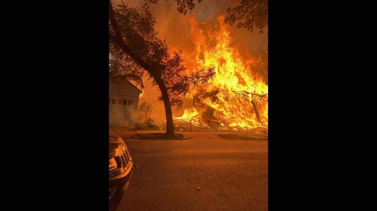 A two-alarm fire on Sunday destroyed two houses under construction in a Kansas City neighborhood between the Westport area and the Country Club Plaza.