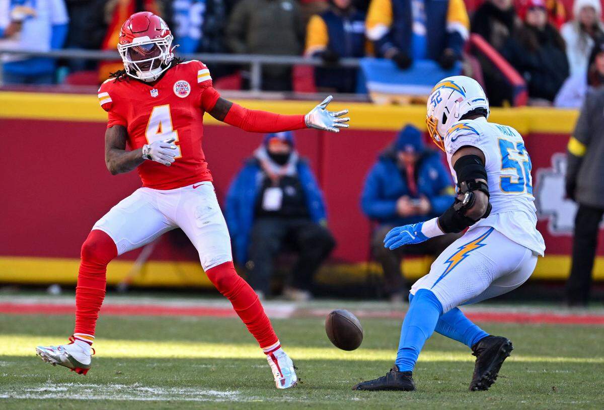 Kansas City Chiefs wide receiver Rashee Rice (4) drops a pass from Kansas City Chiefs quarterback Patrick Mahomes (15) in the third quarter against the LA Chargers at GEHA Field at Arrowhead Stadium on Sunday, Dec. 14, 2025.