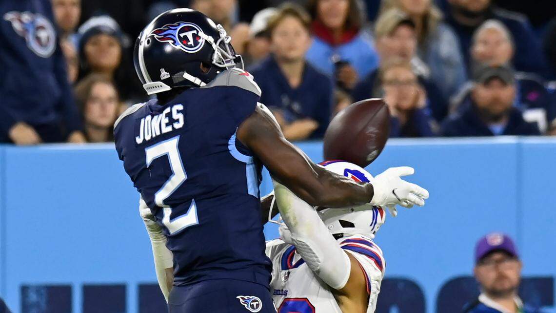 Tennessee Titans wide receiver Julio Jones (2) makes a catch over Buffalo Bills strong safety Micah Hyde (23) in the first half of an NFL football game Monday, Oct. 18, 2021, in Nashville, Tenn. (AP Photo/Mark Zaleski)