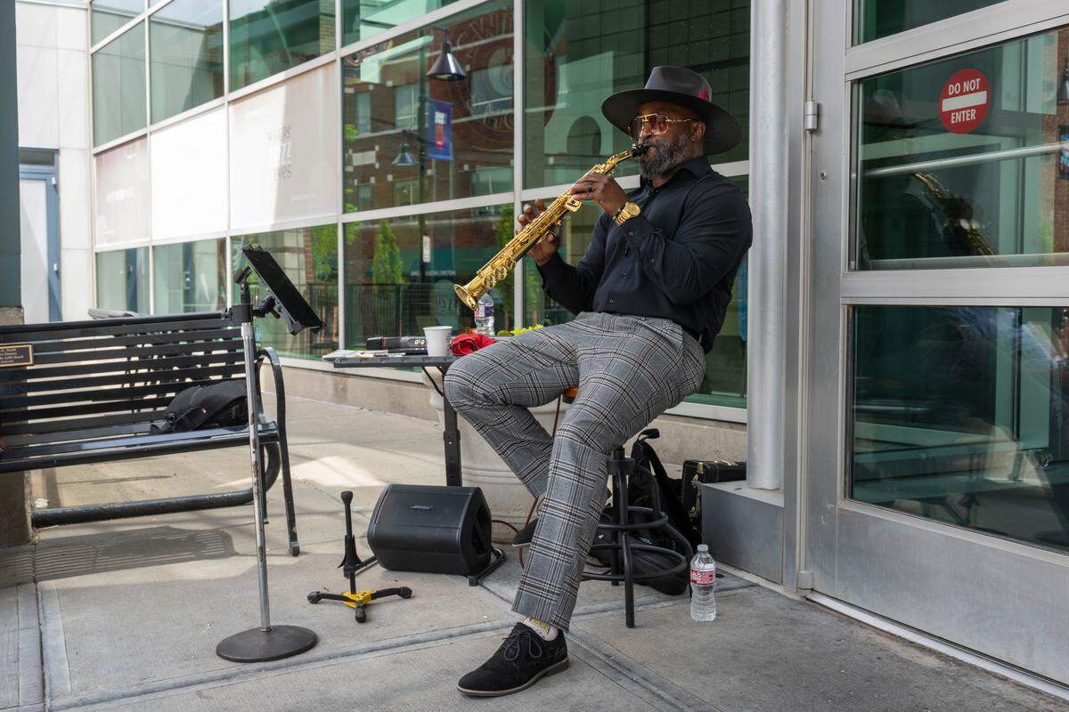 A musician plays jazz flute at the re-opening of the pedestrian mall in the 18th & Vine Jazz District on Wednesday, May 27, 2026, in Kansas City.