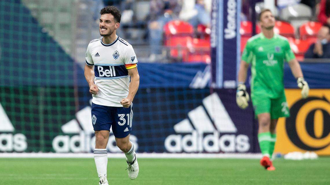 Vancouver Whitecaps player Russell Teibert, left, celebrates his goal against Sporting Kansas City during Sunday night’s Major League Soccer match in Vancouver, Canada.