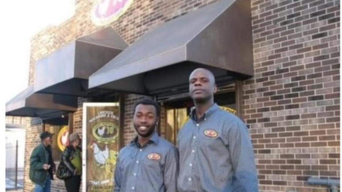 A photo of Dyamund Shields Jr. (left) and his father Dyamund Shields Sr. (right) in front of their business Chicken Mac-N-Cheese. Shields Jr. was killed in an Aug. 5 shooting while working at his food truck on Prospect. Ave. in Kansas City.