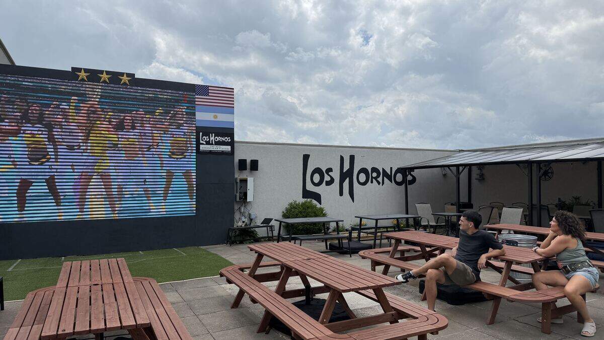 Family of owner Isolina de la Vega watch as the 2026 FIFA World Cup kicks off Thursday, June 11 from the back patio of Los Hornos Argentinian Flavors at 10004 NW Executive Hills Blvd. De la Vega and her husband, who own the restaurants, are going all out to cheer on Argentina.