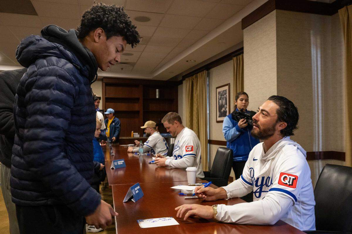Kansas City Royals second baseman Jonathan India gives his signature to Thomas Smith during Royals Rally at Kauffman Stadium on Saturday, January 31, 2026.