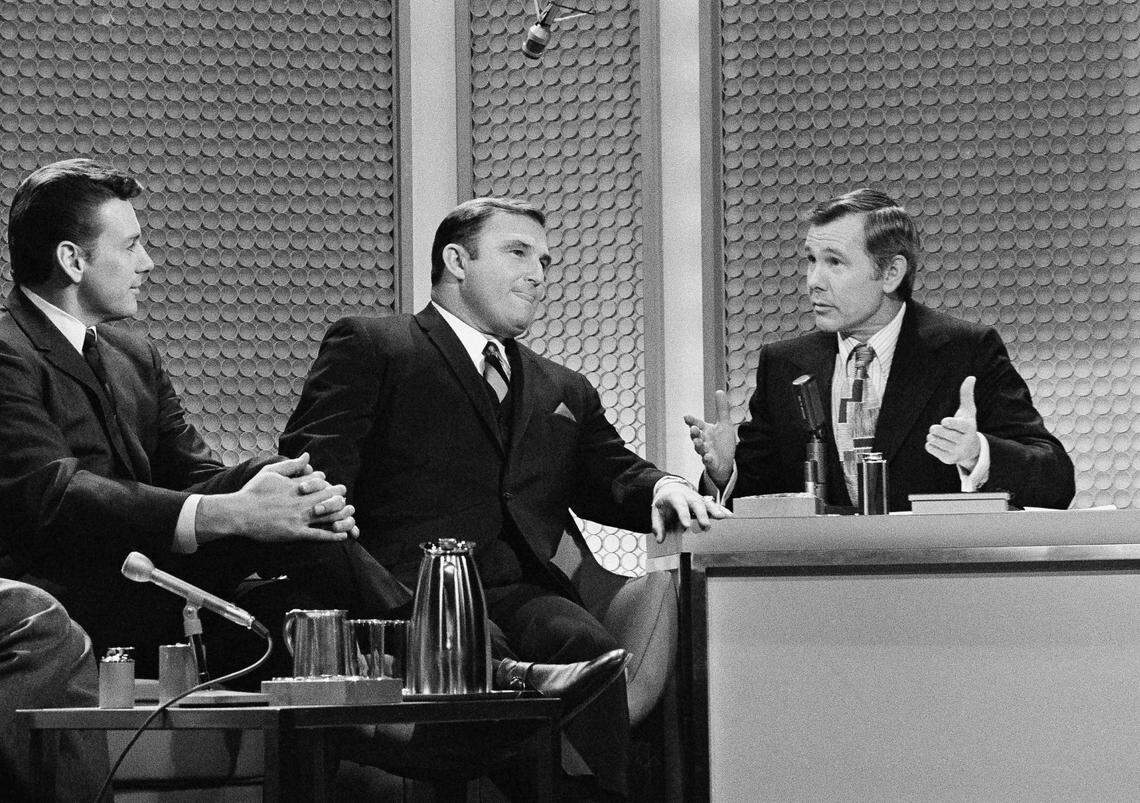 Quarterback Len Dawson, left, and coach Hank Stramm, center, listen as comedian Johnny Carson makes a point during taping of the NBC-TV “Tonight Show” on Jan. 13, 1970 in New York. The star quarterback and coach of the Kansas City Chiefs, victors in the 1970 Super Bowl game were guests of the show.