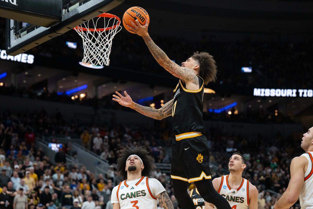 Missouri Tigers guard Jayden Stone (17) drives to the basket for a layup and a foul in the second half of the Tigers first-round NCAA Tournament matchup vs. the Miami Hurricanes at Enterprise Center in St. Louis on Friday, March 20, 2026.