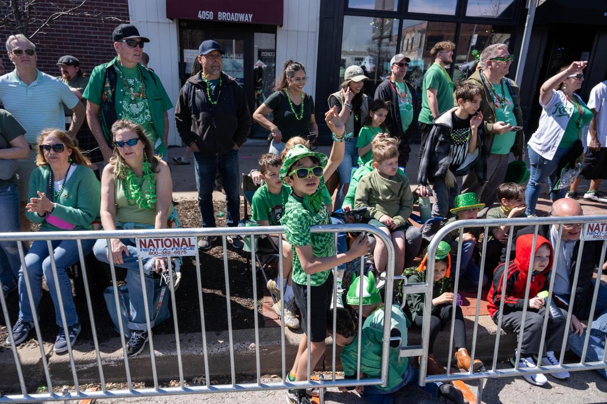 Bystanders take in the sights of the Kansas City St. Patrick’s Day Parade on Monday, March 17, 2025.