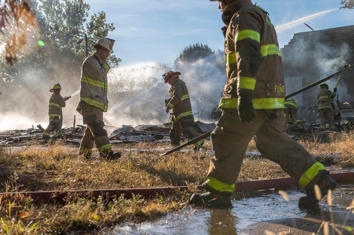 Firefighters battle a fire at an abandoned apartment complex on Thursday at 2409 Mill Street in Kansas City, Kansas Firefighters battled a blaze at the same apartment complex on Wednesday.