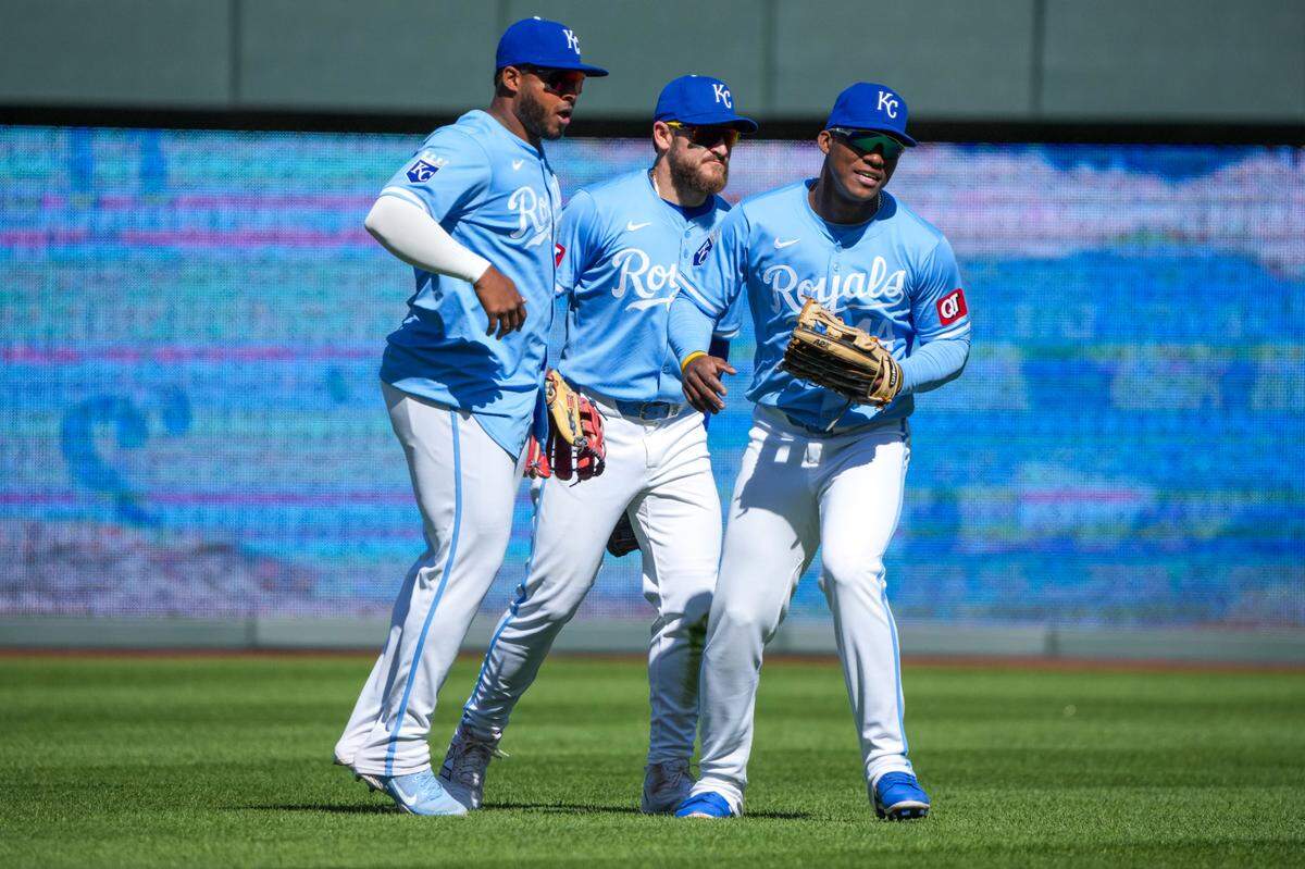 Kansas City Royals left fielder Nelson Velázquez (17), center fielder Kyle Isbel (28) and outfielder Dairon Blanco (44) celebrate after the win over the Houston Astros at Kauffman Stadium on April 11, 2024.