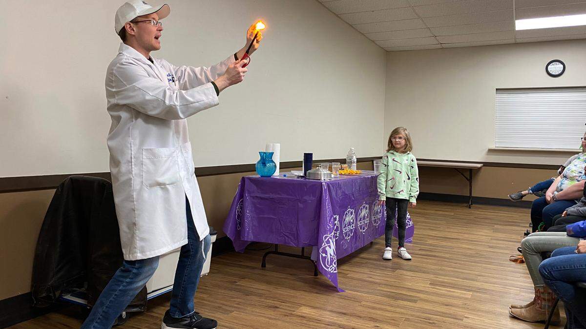 A performer from Mad Science puts on a show for a group of Edgerton kids.