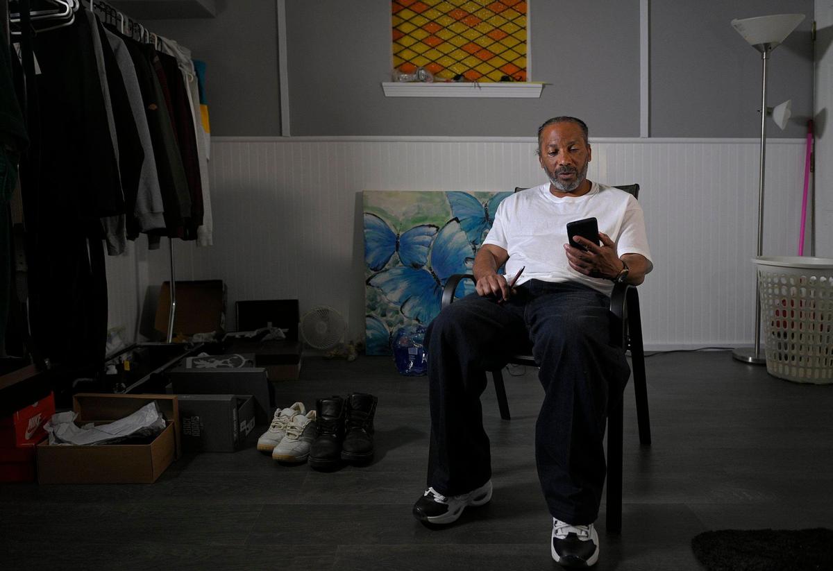 Kevin Strickland has found using a cell phone to be a challenging experience, especially because of the many calls and texts he is bombarded with. Strickland, 62, exonerated in a 1978 triple murder that Jackson County prosecutors said he did not commit, has been free for about a month. He has kept and often uses his prison shoes and work boots, shown on the ground.
