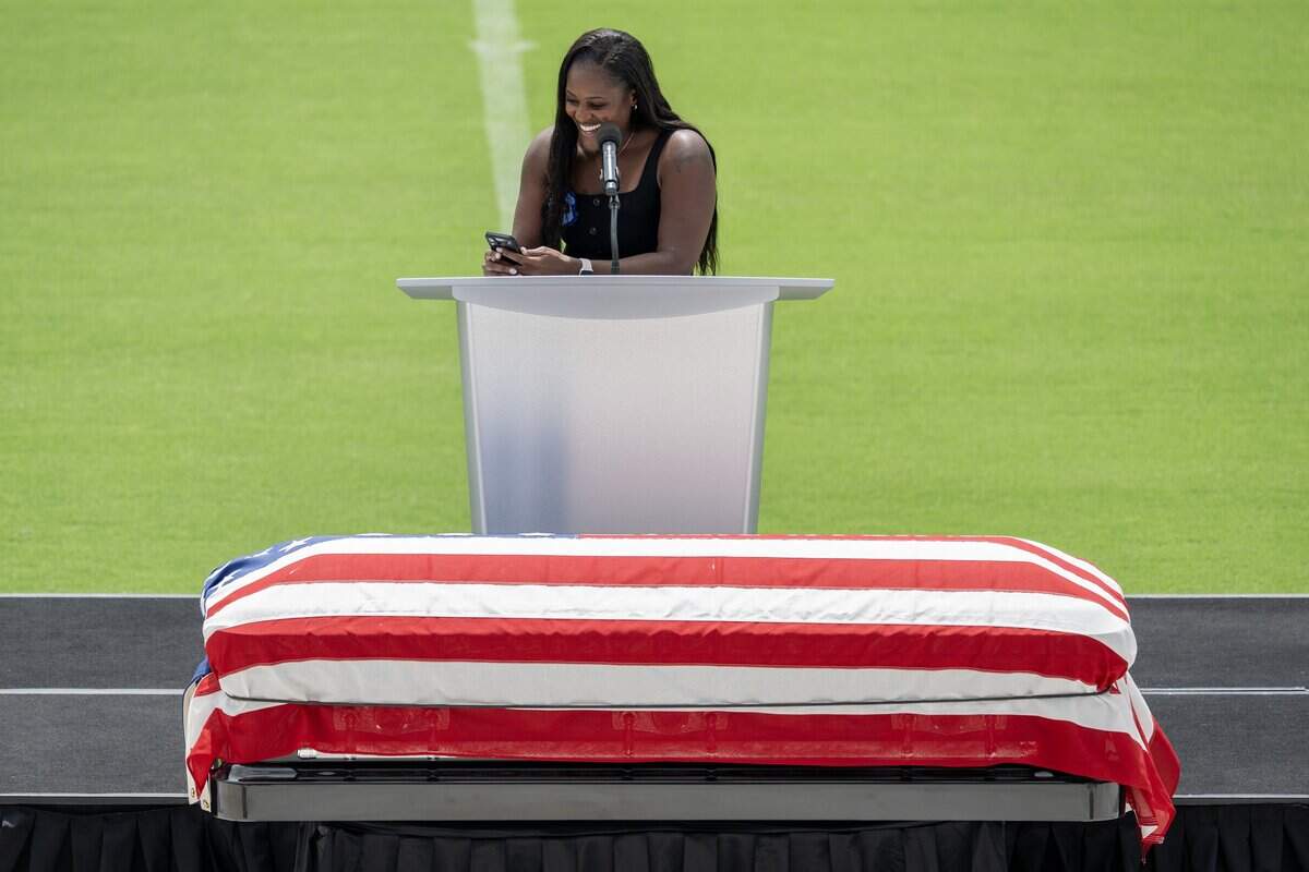 A family representative smiles as she speaks during a memorial service honoring Deputy Elijah Ming at Children's Mercy Park on Monday, Aug. 11, 2025, in Kansas City, Kansas. Ming, a nine-year veteran of the Wyandotte County Sheriff's Office was killed in the line of duty on July 26 while responding to a domestic-standby call in south Kansas City, Kansas.