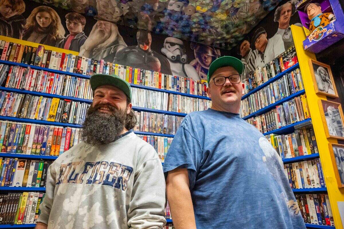 Owners Alex Quinn and Pat Clifton inside Gnarly Hussle, a vintage clothing store in Raytown, on Thursday, Nov. 20, 2025. In addition to selling vintage clothing, the shop features a bar/hangout area where people can come to “just be.”