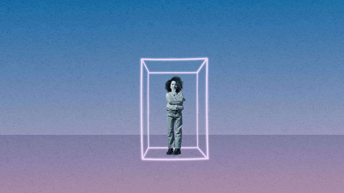 Full length of girl with hand on chin standing in cube against colored background