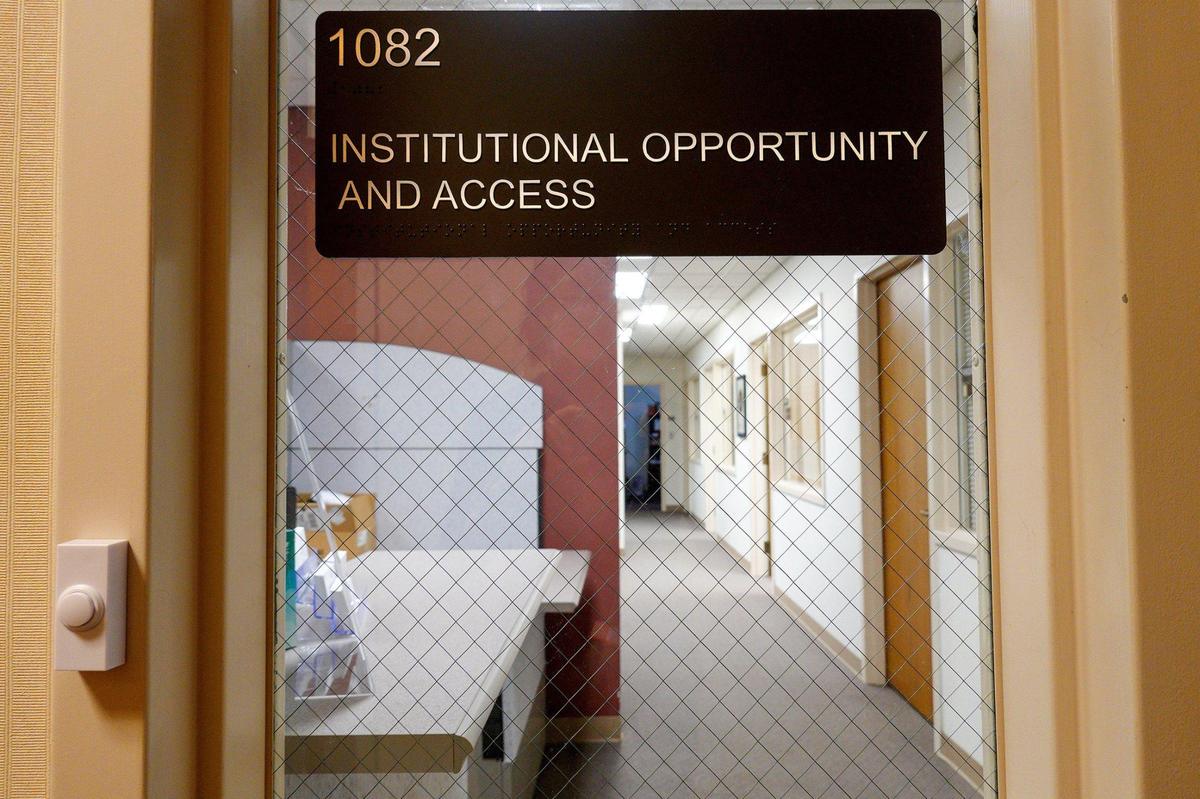 The Office of Civil Rights and Title IX on the University of Kansas campus in Lawrence is photographed from a doorway. In 2016, a graduate student went to the office to file a report of sexual harassment but continued to experience problems on campus and settled a lawsuit against the university.