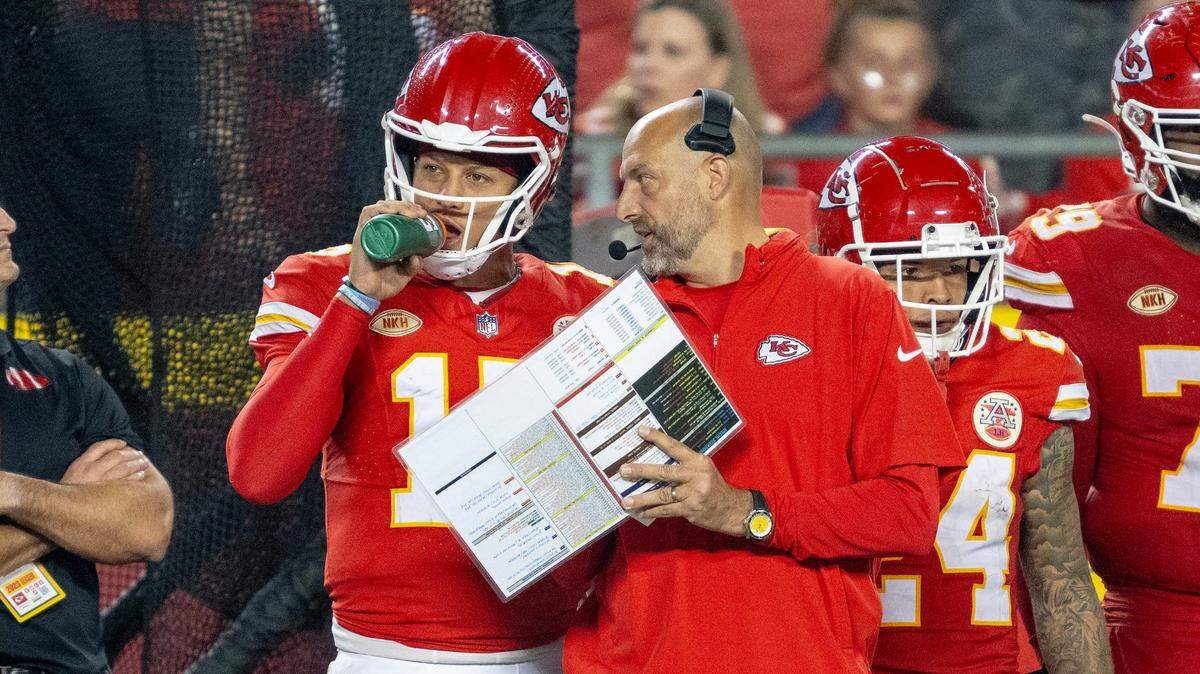 Chiefs offensive coordinator Matt Nagy, right, talks with quarterback Patrick Mahomes on the sideline during Thursday night’s game at GEHA Field at Arrowhead Stadium.