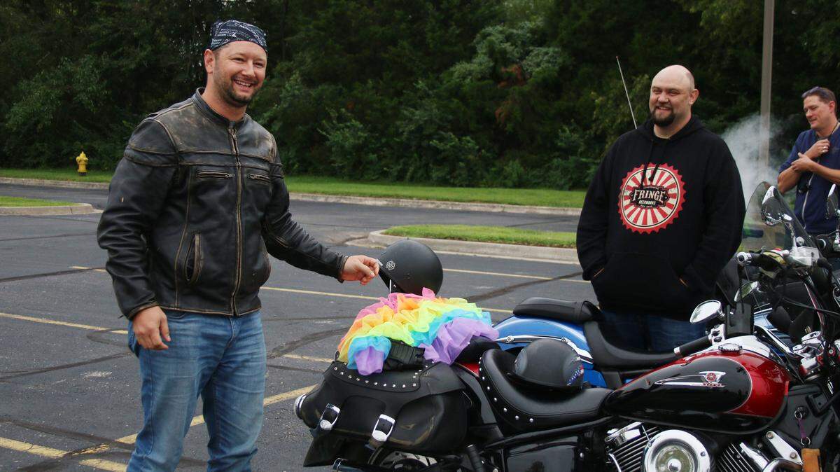 Robert Buchanan was prepared to wear a tutu if donations hit $2,000. Eddie Pease, a sponsor of the ride, and participant Jeff Hicks waited with Saturday morning for the start of the ride.