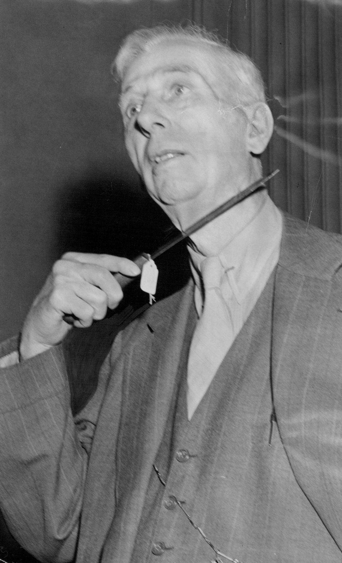 Attorney John T. Barker exhibits the butcher’s knife during the subsequent trial.
