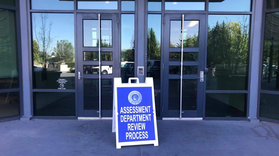 A sign marking the location of the Jackson County Assessment Office’s property valuation review process is seen outside the south entrance to 1300 Washington in downtown Kansas City on Wednesday, May 3, 2023.