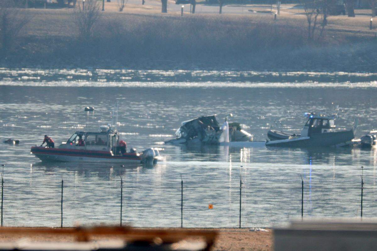 Emergency response units search the crash site of an American Airlines plane on Jan. 30, 2025, on the Potomac River after an accident the previous night near Reagan National Airport. The American Airlines flight from Wichita, Kansas, collided midair with a military Black Hawk helicopter while on approach. Authorities said there were no survivors among the 67 people on both aircraft.