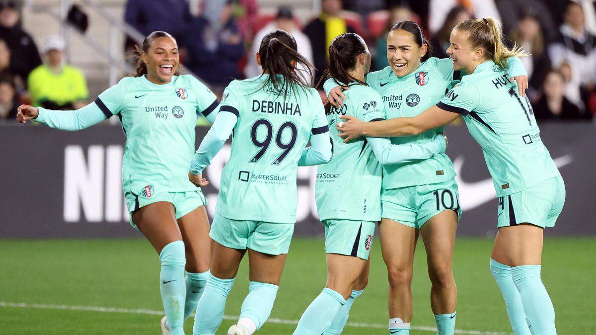 Kansas City Current midfielder Lo’eau LaBonta (10) celebrates with her teammates after scoring a goal during the second half against the Washington Spirit at Audi Field in Washington, D.C., on March 22, 2025.