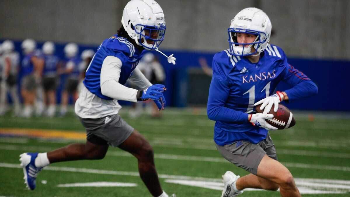 Kansas wide receiver Luke Grimm (11) works on a play during a Spring 2023 practice at the Kansas Jayhawks’ indoor practice facility.