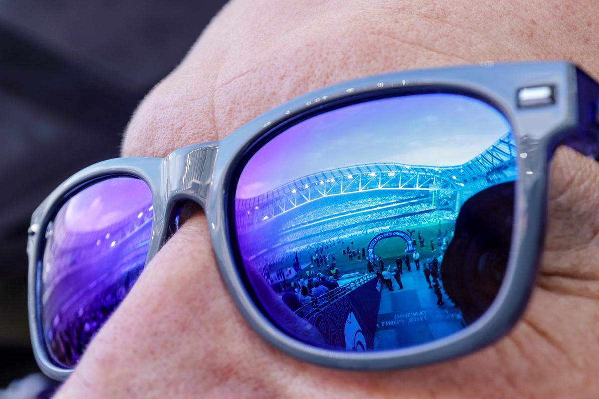 A general view of the field reflected in a fan's glasses during the Aer Lingus Classic between Iowa State and Kansas State at Aviva Stadium in Dublin on Aug. 23, 2025.