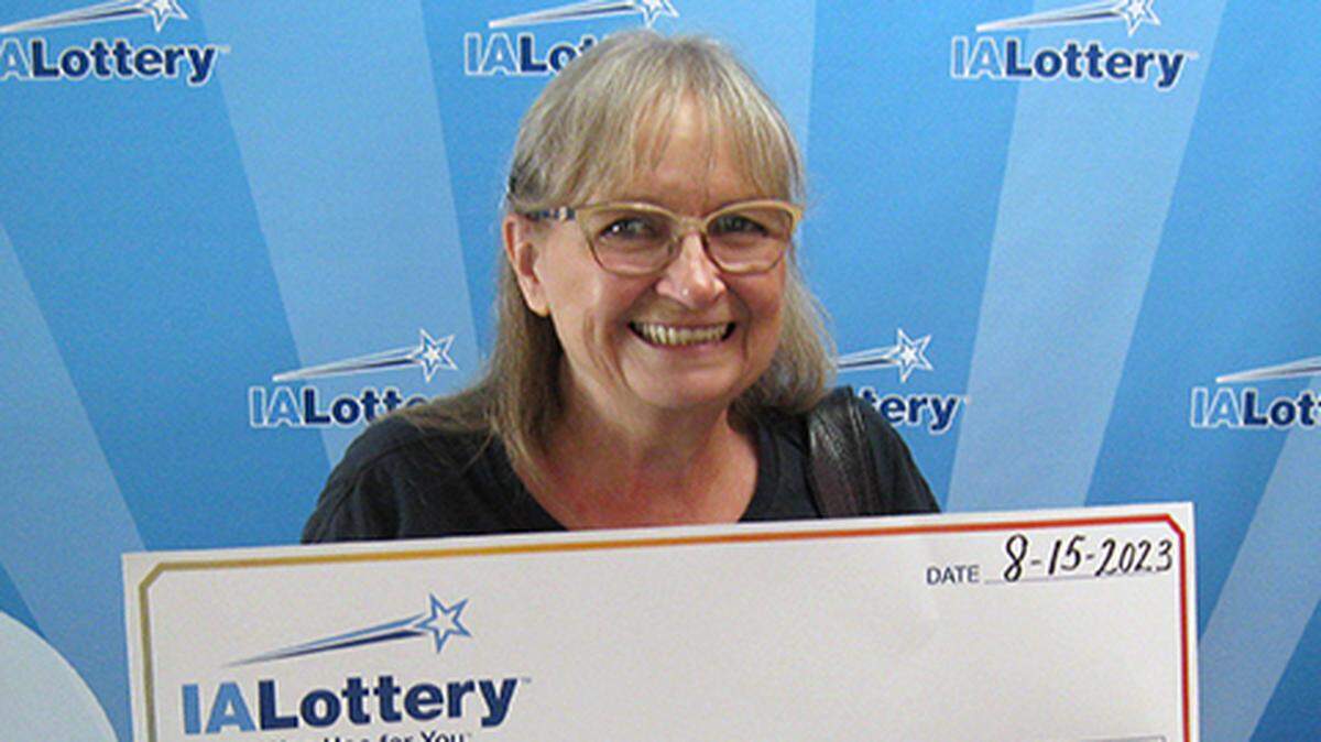 Pamela Litzel, 70, with her oversized check.