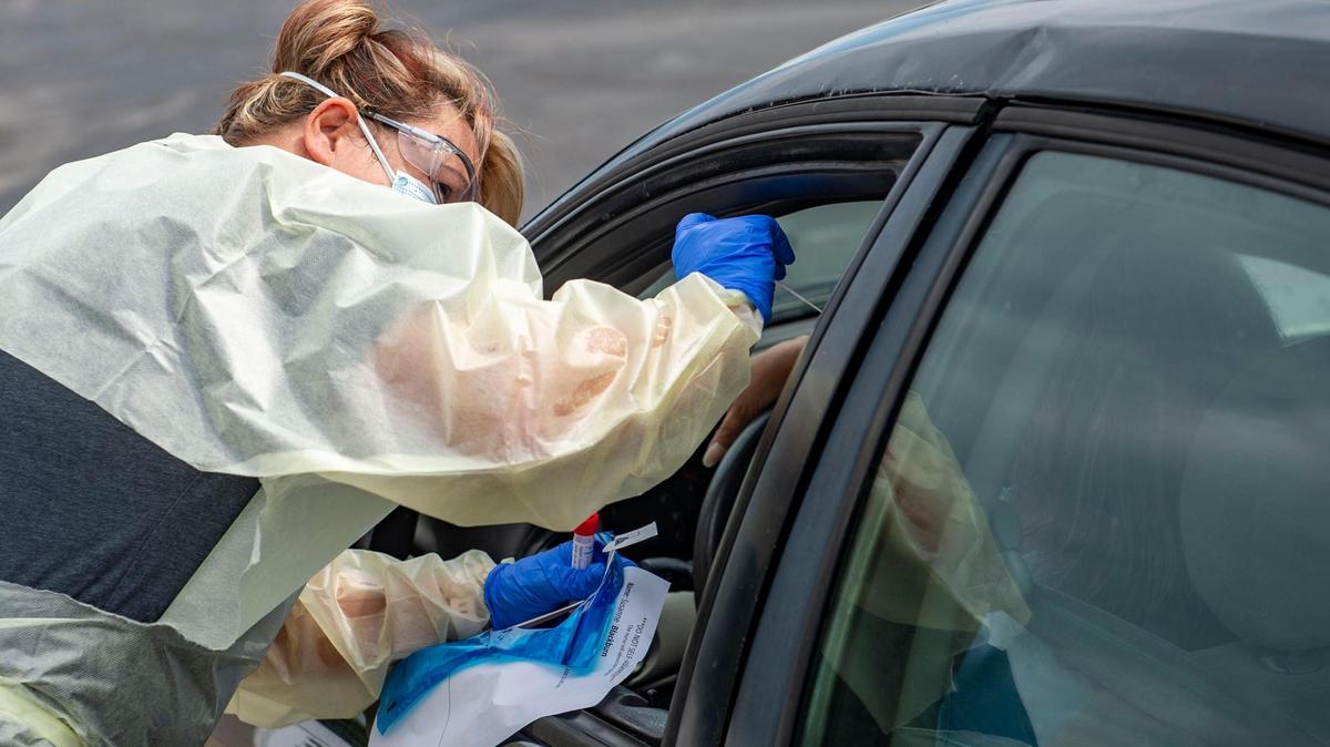 Vickie Walker completes a nasal swab to test for COVID-19 at the drive up clinic at Legend’s Football Complex Wednesday in Lee’s Summit. Missouri is experiencing a rise in COVID-19 cases and hospitalizations due in part to the spread of the delta variant.