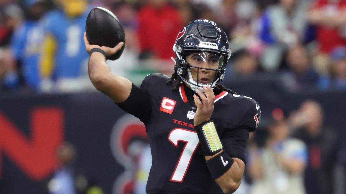 Houston Texans quarterback C.J. Stroud (7) looks to pass during the first quarter against the Los Angeles Chargers in an AFC wild card game at NRG Stadium.