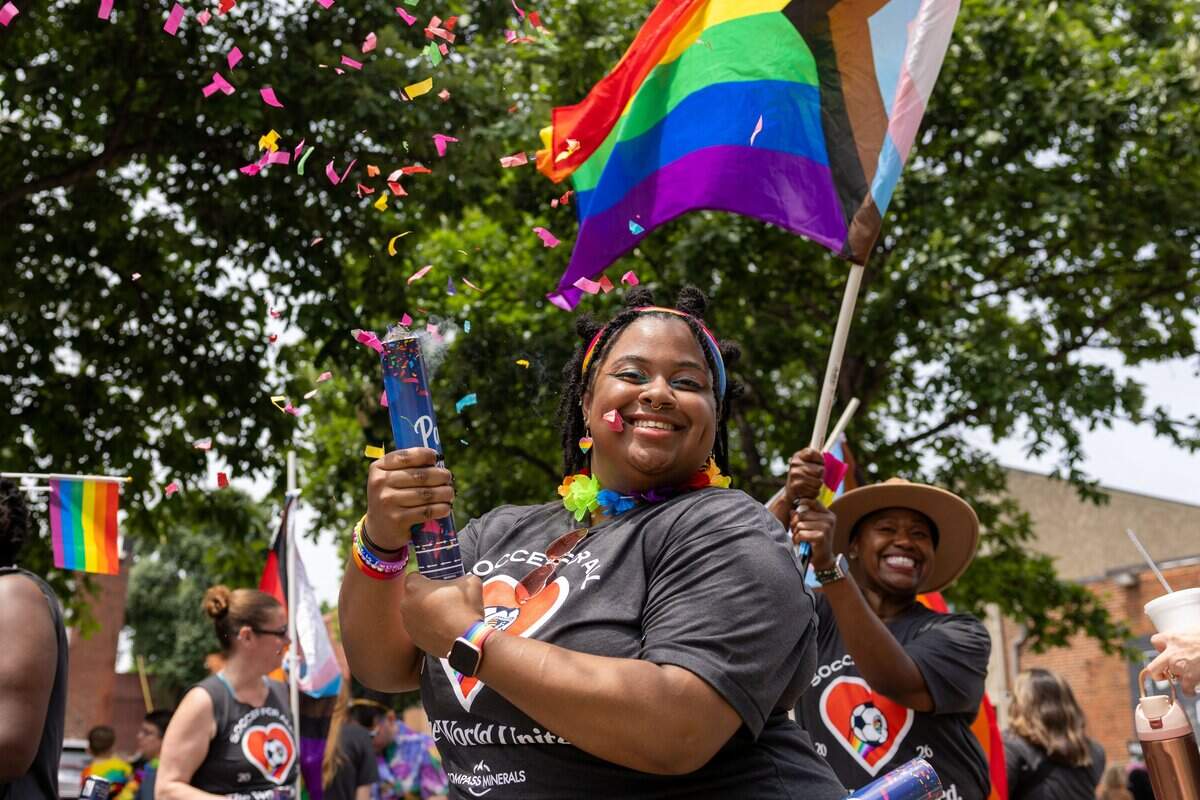 Parade attendee pops a confetti cannon while they walk in Kansas City's Annual Pride Parade at Westport Rd on Saturday, June 6, 2026.