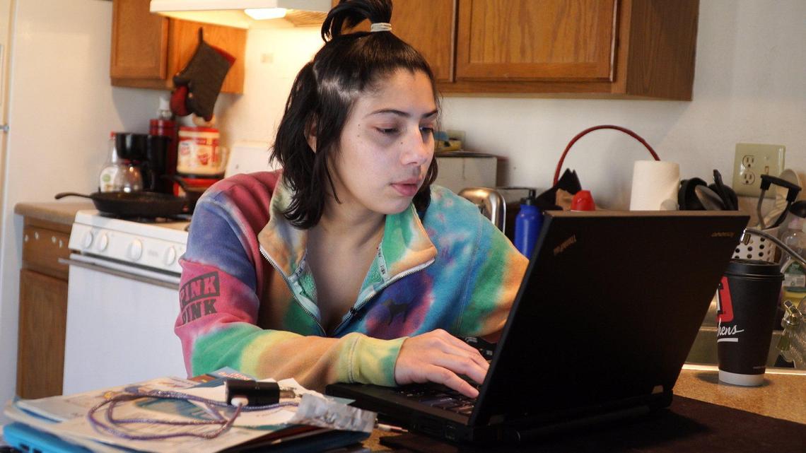 Former foster child Natalie Zarate applied for jobs online while staying in her former foster sister’s apartment.